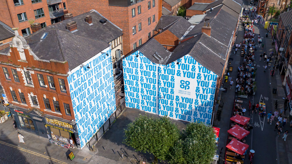 Co-Op mural on the walls of two buildings