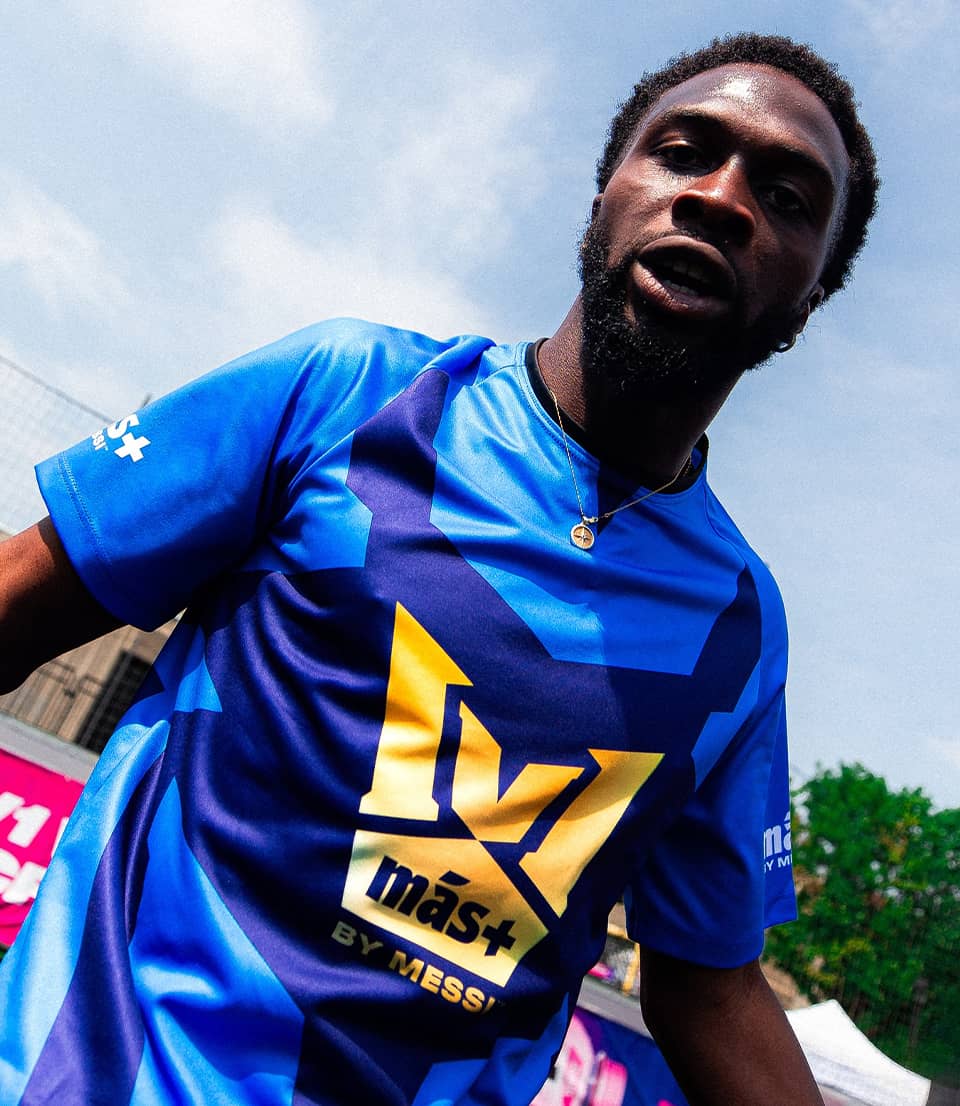 A soccer player with 1v1 logo on dress