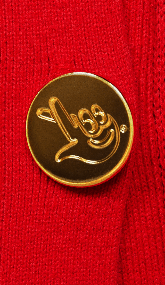 A golden knob with finger-crossed emoticon